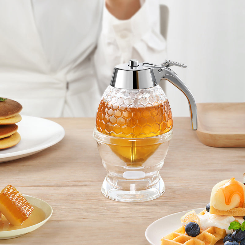 Distributeur de miel, sirop, beau pot à miel en nid d'abeille